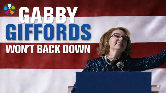 Movie poster for Gabby Giffords Won't Back Down featuring Gabby, a white woman in her 50s, at a podium speaking