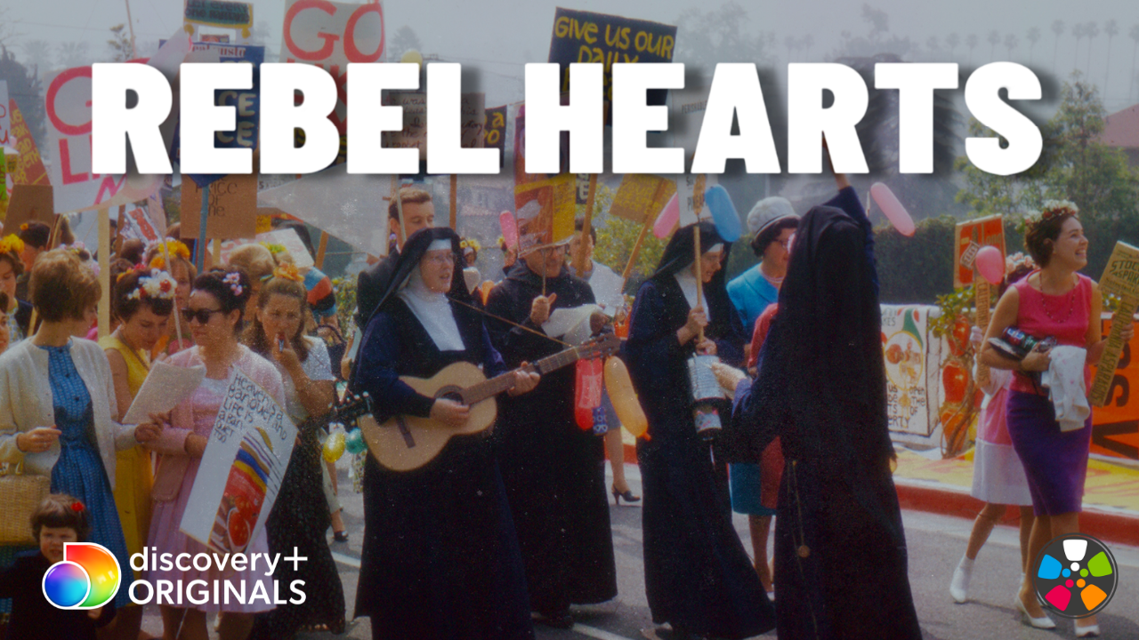 Nuns leading a group of protesters in song (one of the nuns carries and plays a guitar). Text across the top reads: Rebel Hearts. Discovery channel logo bottom left. Journeys in Film logo bottom right.