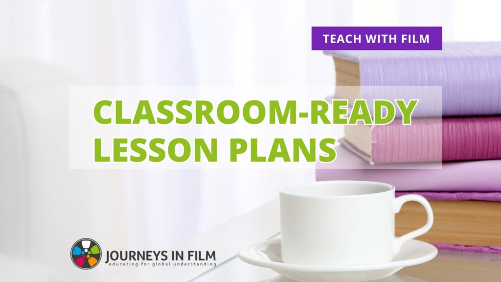 In a bright, sunny room, a delicate white mug sits on a saucer next to a stack of silk-bound books in sunrise shades of purple, pink, raspberry and lavender. Text says: "Classroom-Ready Lesson Plans. Teach with Film." The Journeys in Film logo is at the bottom.