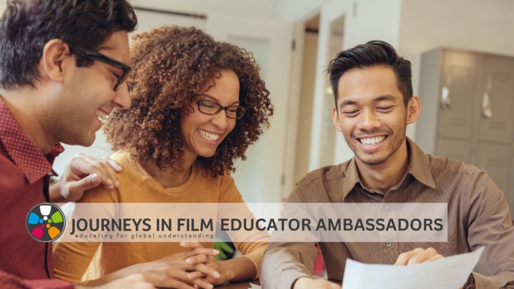 Photograph of three teachers of color, two men and a woman, seated together at a table, looking at a paper and smiling brightly. Text at the bottom says: "Journeys in Film Educator Ambassadors.