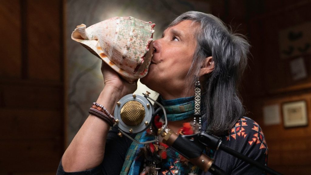 Indigenous / Native American musician Pura Fé blows into a conch shell in a performance in My Music with Rhiannon Giddens Season 2, Episode Six. Teaching resources for this episode are available for free from Journeys in Film.